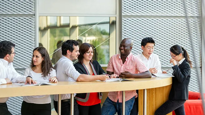 International staff, visiting scholars and doctoral students in the lobby of the Institute for Advanced Studies